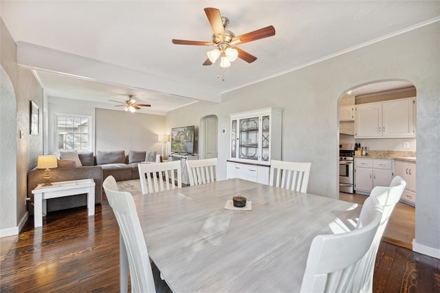 dining room featuring crown molding, ceiling fan, and dark hardwood / wood-style flooring