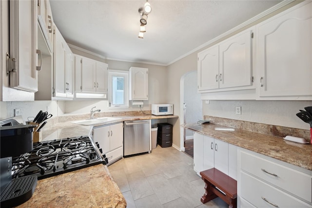 kitchen featuring dishwasher, crown molding, sink, and white cabinetry