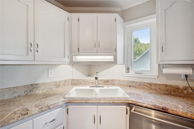 kitchen featuring dishwasher, crown molding, white cabinets, and sink