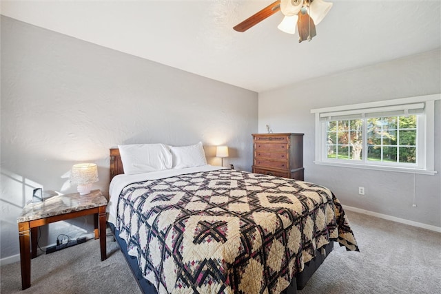 bedroom with ceiling fan and carpet flooring