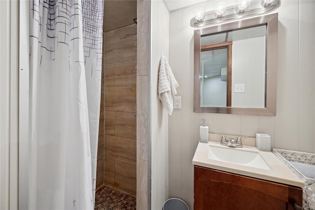 bathroom featuring vanity and a shower with shower curtain