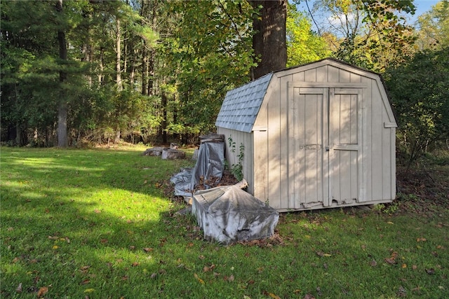 view of outdoor structure with a lawn