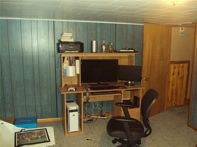 carpeted office with wooden walls