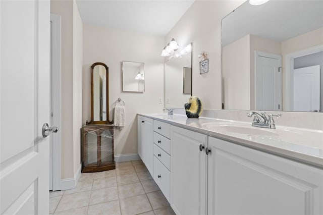 bathroom featuring tile patterned flooring and vanity