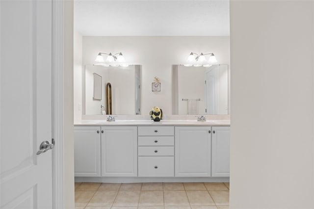 bathroom with tile patterned floors and vanity