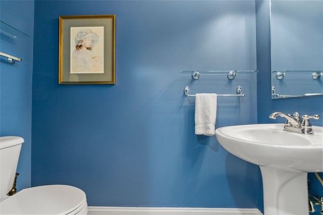 bathroom featuring sink and toilet