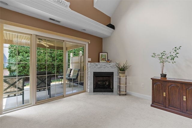 unfurnished living room featuring light carpet, vaulted ceiling, and ceiling fan