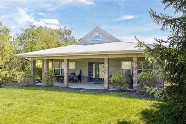 back of house featuring a yard and a patio