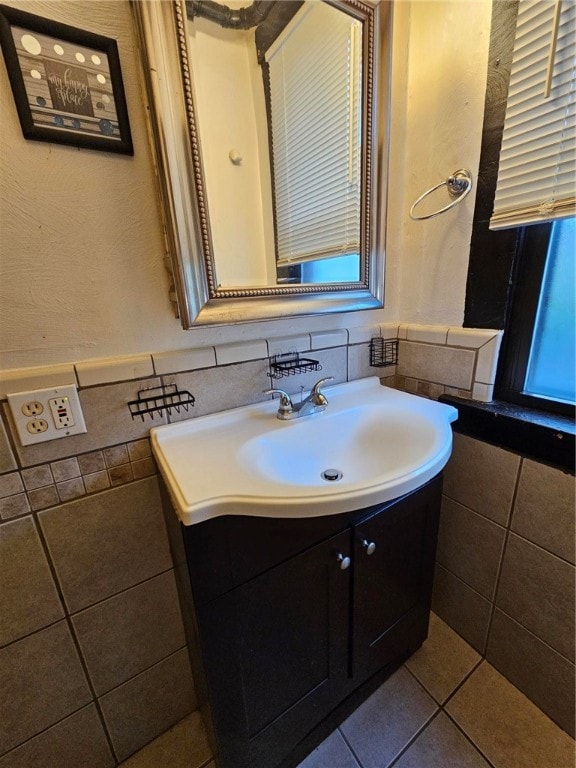 bathroom with vanity, tile walls, and tile patterned floors