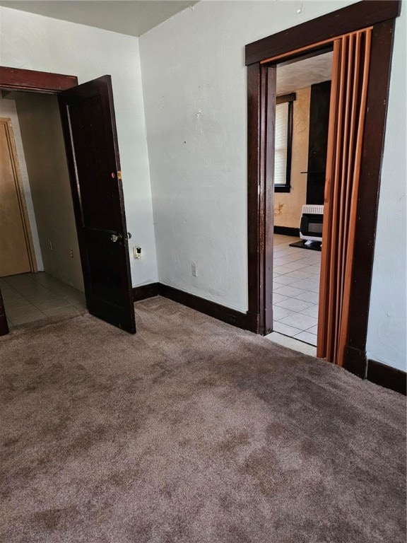 spare room featuring light colored carpet