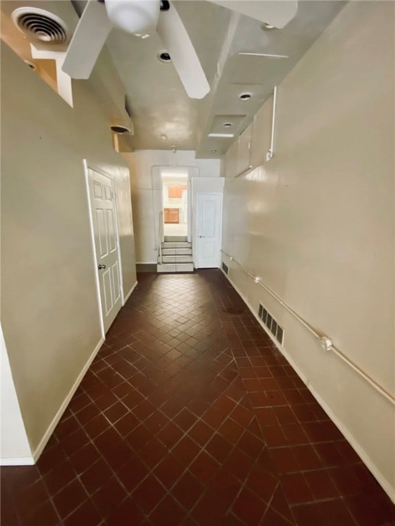 empty room featuring dark tile patterned floors