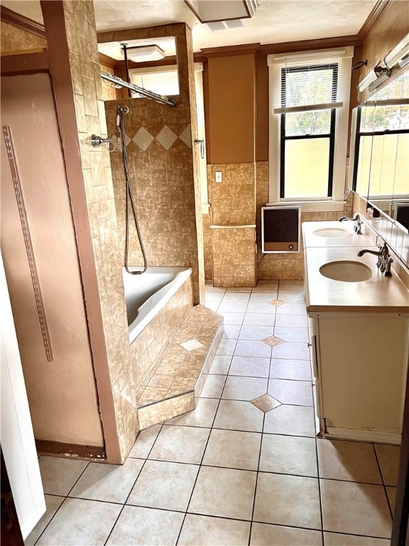 bathroom featuring tile patterned floors, vanity, and tiled shower / bath combo