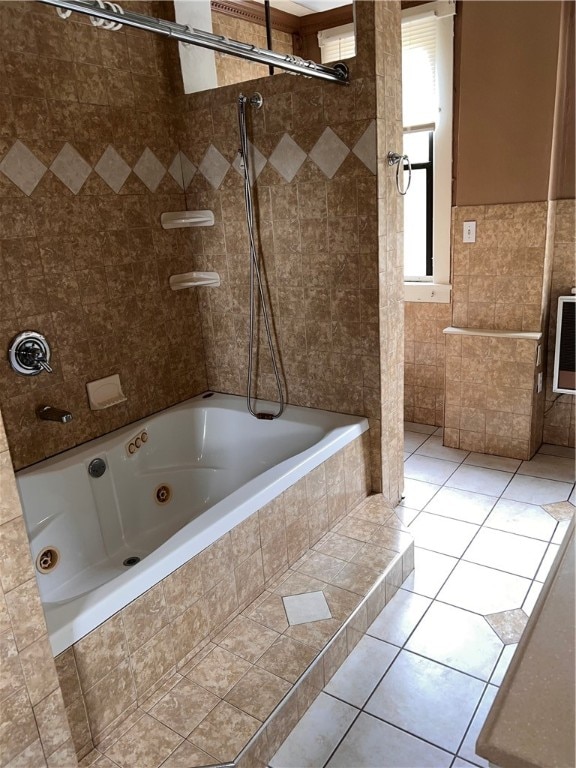 bathroom featuring tiled shower / bath and tile patterned floors