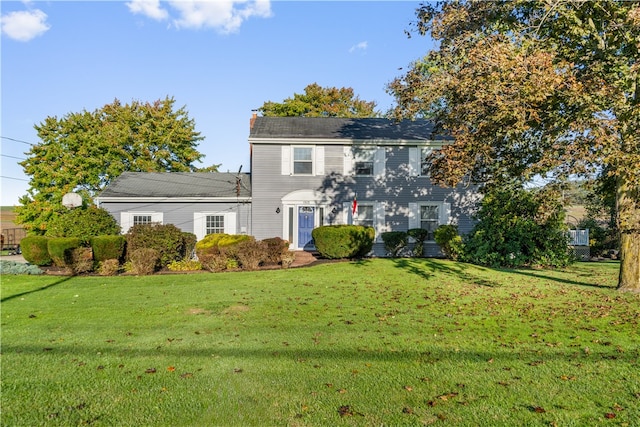 colonial home with a front yard