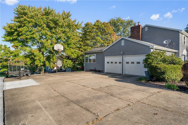 view of side of property with a garage