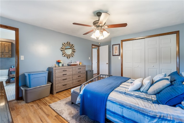 bedroom featuring ceiling fan, light hardwood / wood-style flooring, and a closet