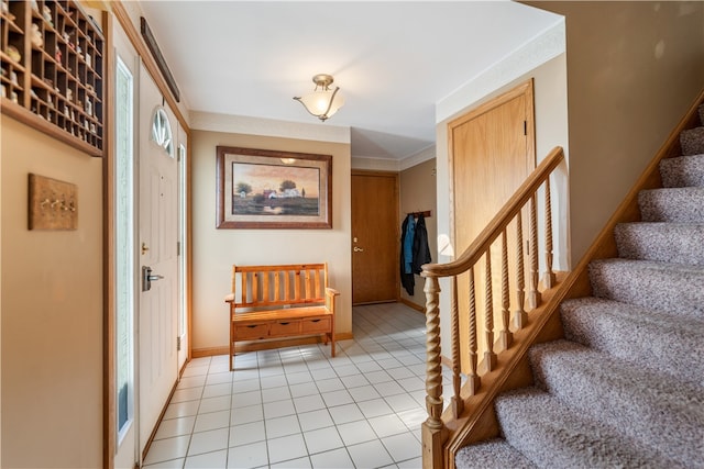 tiled entryway with ornamental molding