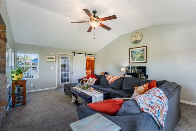 living room featuring a barn door, lofted ceiling, carpet, and ceiling fan