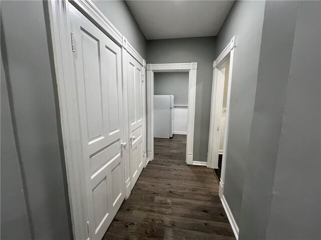 hall with dark wood-type flooring