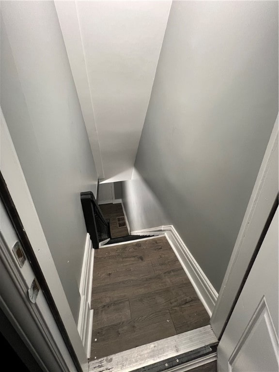 staircase featuring hardwood / wood-style flooring