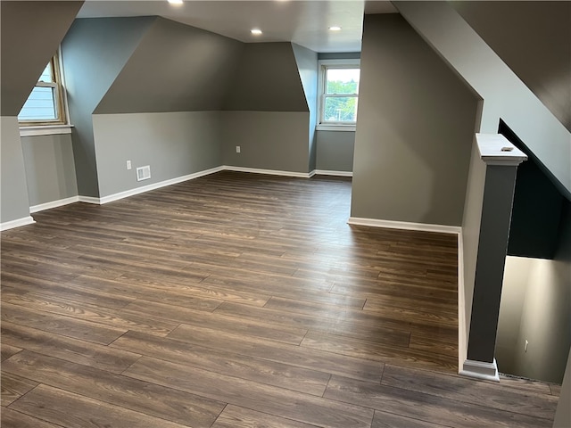 bonus room featuring lofted ceiling and dark hardwood / wood-style floors