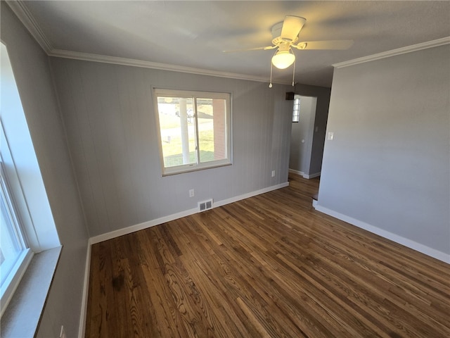 empty room with dark wood-type flooring, crown molding, and ceiling fan