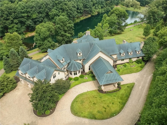 birds eye view of property with a water view