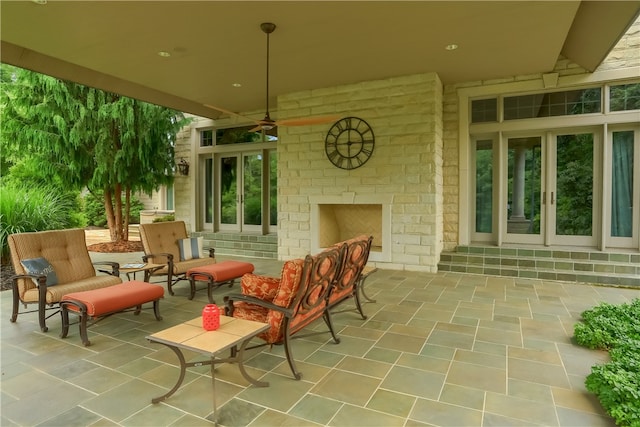 view of patio / terrace with an outdoor brick fireplace