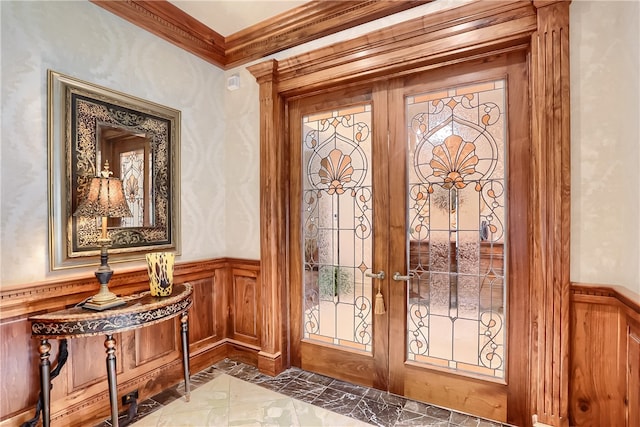 foyer featuring ornamental molding and french doors