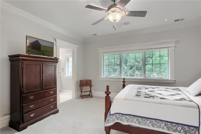 carpeted bedroom with crown molding and ceiling fan