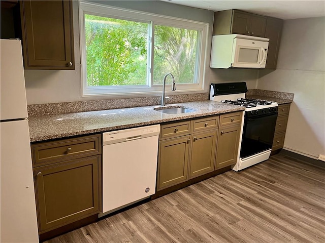 1611 Crawford Rd, North Fayette, PA 15126 - kitchen featuring white appliances, a sink, light wood-type flooring, and light stone countertops