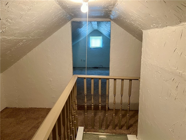 stairway with lofted ceiling