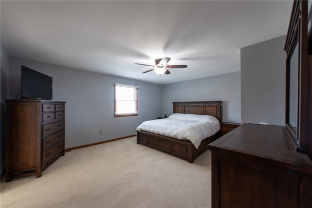 bedroom featuring ceiling fan and light colored carpet