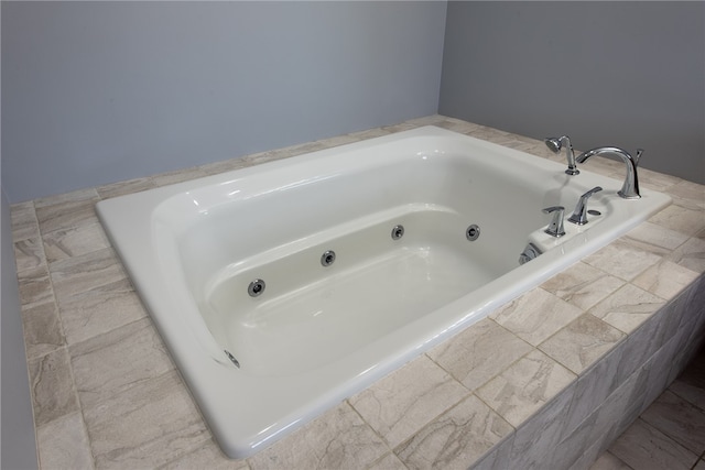 bathroom with tiled bath