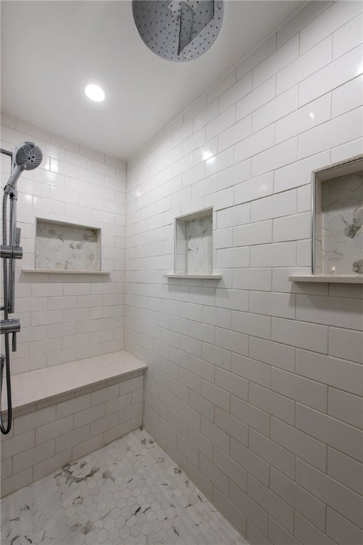 bathroom featuring tiled shower