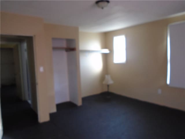 unfurnished bedroom featuring a closet