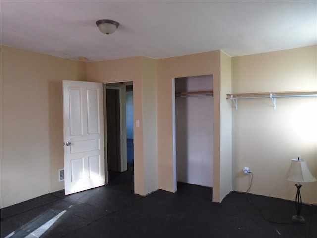 unfurnished bedroom with a closet