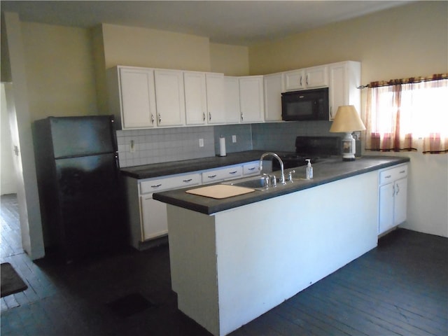 kitchen with white cabinets, sink, black appliances, dark hardwood / wood-style floors, and decorative backsplash