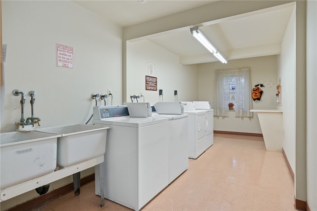 clothes washing area featuring independent washer and dryer