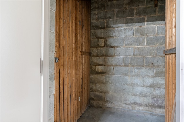 details with wood walls and concrete flooring