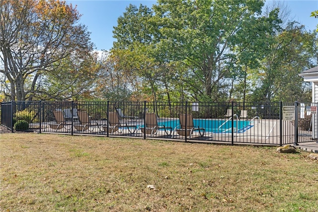 view of swimming pool with a lawn and a patio area