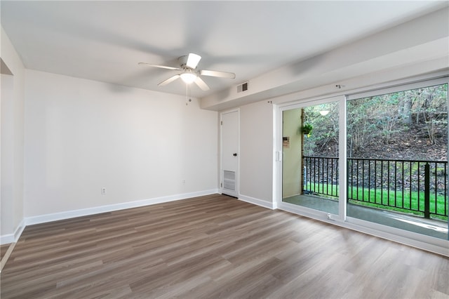 spare room with ceiling fan and hardwood / wood-style floors