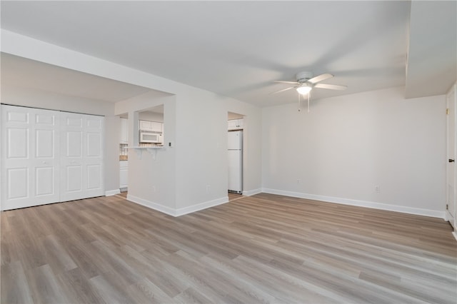 interior space featuring ceiling fan and light hardwood / wood-style floors