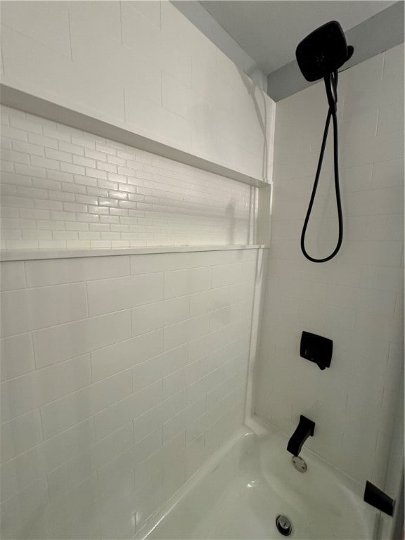 bathroom with a tile shower