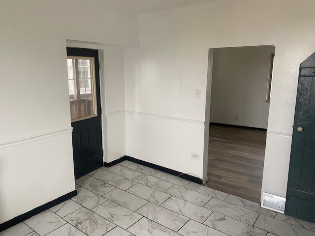 empty room with light wood-type flooring