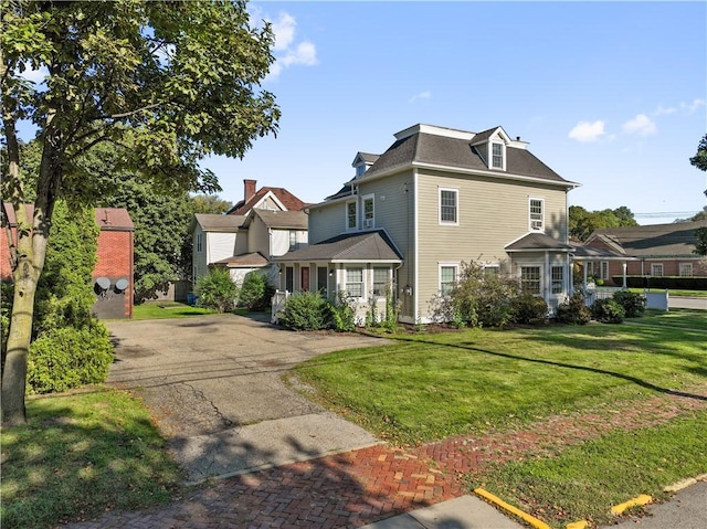 exterior space featuring a front lawn