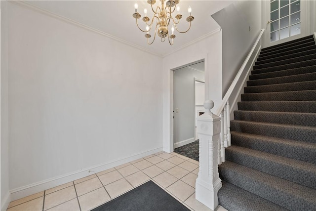 stairs with tile patterned flooring, ornamental molding, and an inviting chandelier