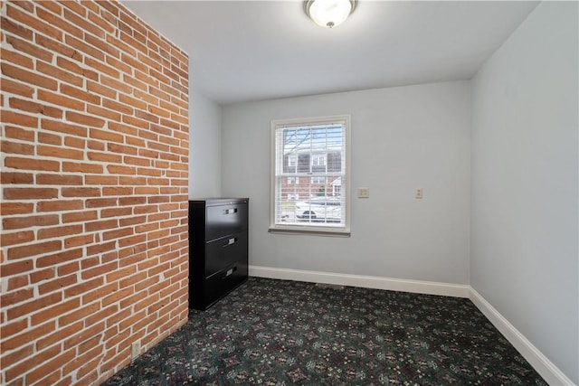 unfurnished room featuring dark colored carpet