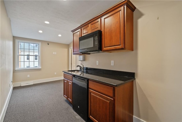 kitchen featuring dark stone counters, black appliances, dark colored carpet, sink, and a textured ceiling