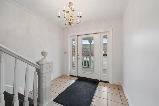 entryway with ornamental molding, a notable chandelier, and light tile patterned flooring